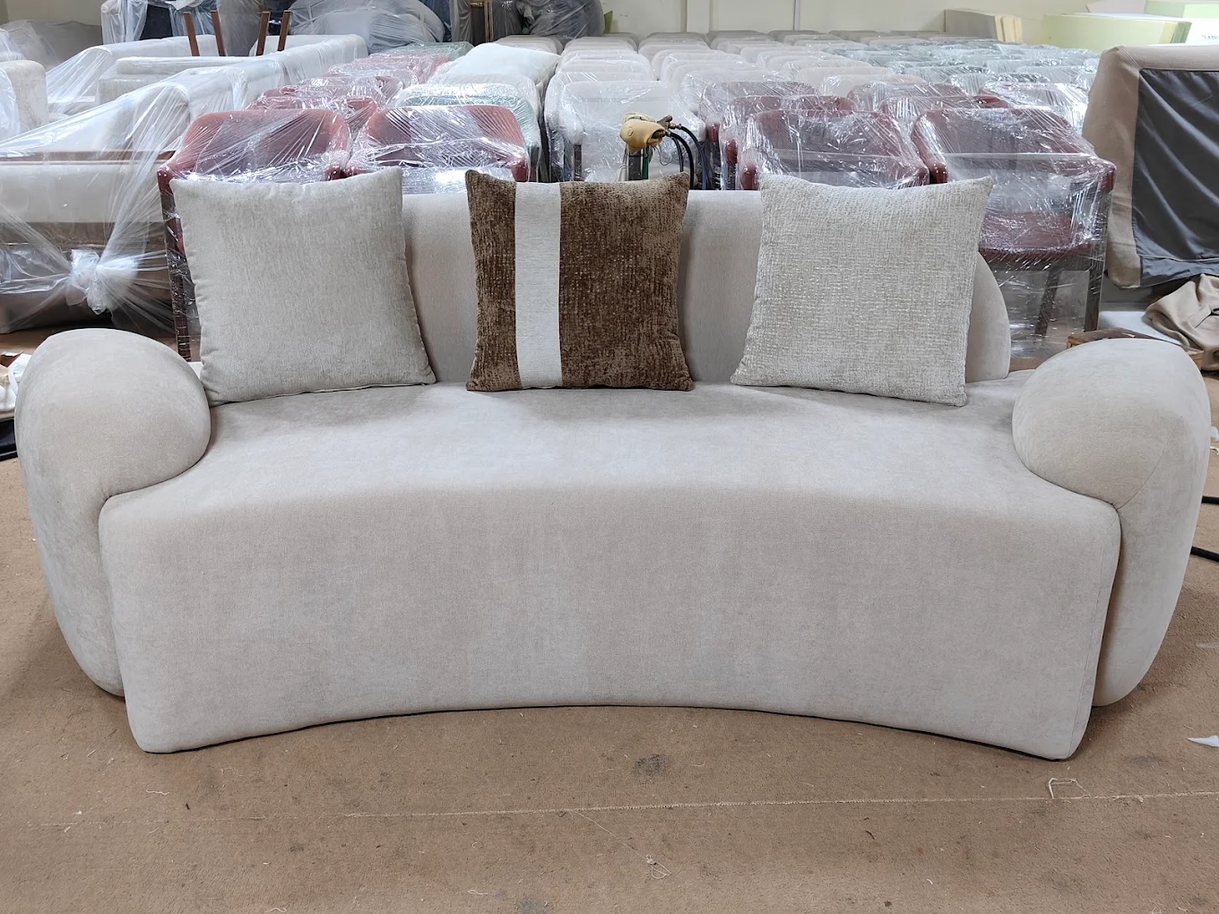 Curved statement sofa in oatmeal chenille fabric
